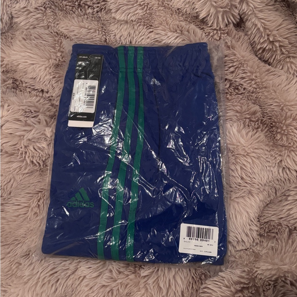 Adidas Tecg Fleece Blue Pants with green stripes